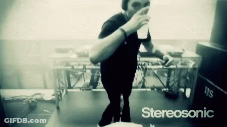 Black And White Man Drinking From Cup With Stereosonic GIF