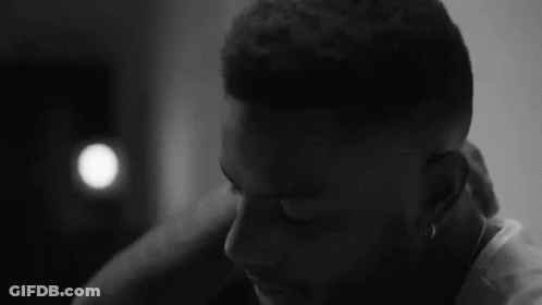 Black And White Man Eyes Closed Hand On Neck GIF