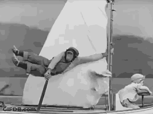 Black And White Man Flying On Boat GIF