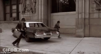 Black And White Man Getting Out Of Car GIF
