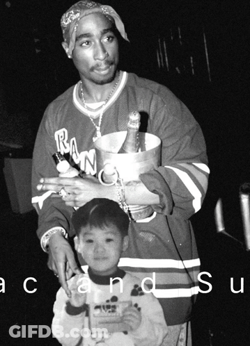 Black And White Man Holding Bucket Of Champagne And Little Boy GIF
