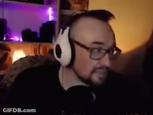 Black And White Man Holding Gun In White Hoodie GIF