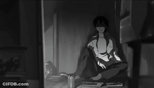 Black And White Man Holding Remote In Dark Room GIF