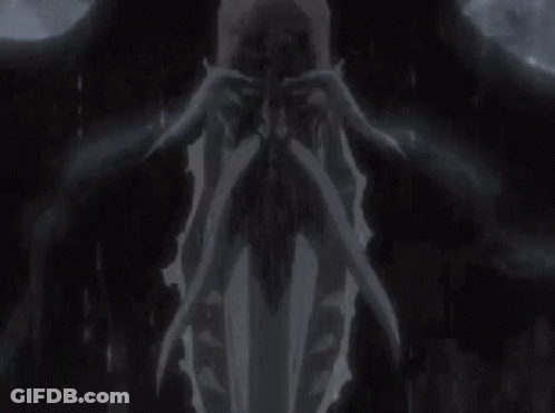 Black And White Man Holding Skull In Rain GIF
