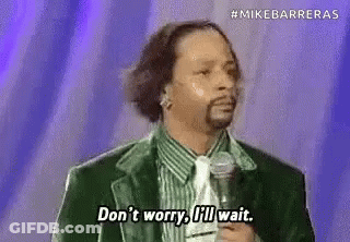 Black And White Man Holding Trophy In Room GIF