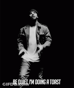 Black And White Man In Beanie Jacket Mic GIF