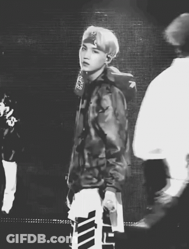 Black And White Man In Camo Jacket Holding Microphone GIF