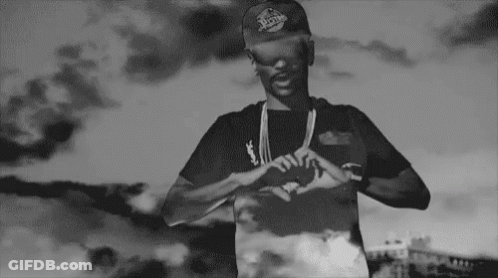 Black And White Man In Hat Making Heart Hands GIF