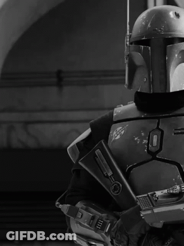 Black And White Man In Helmet Holding Gun GIF