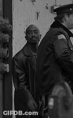 Black And White Man In Leather Jacket And Police Officer GIF
