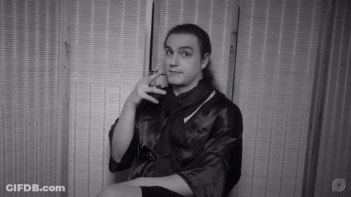 Black And White Man In Robe With Letter P GIF