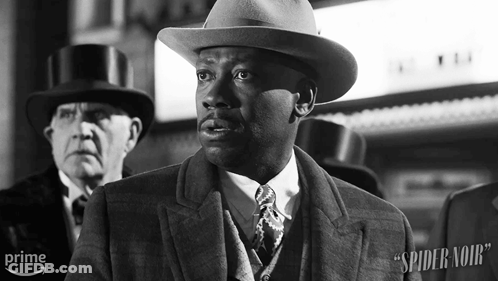 Black And White Man In Suit And Hat Spider Noir GIF