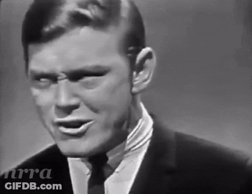 Black And White Man In Suit And Tie With NRA GIF