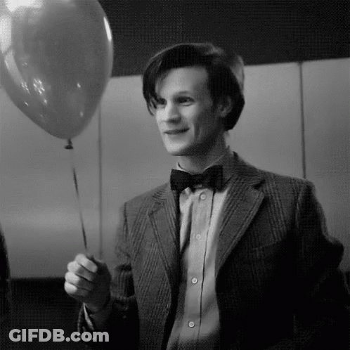 Black And White Man In Suit Holding Balloon GIF