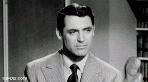 Black And White Man In Suit Making Funny Face GIF