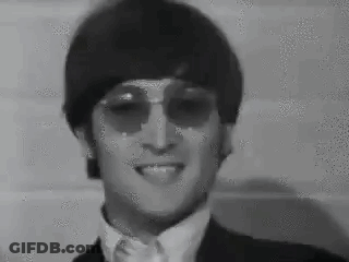 Black And White Man In Suit, Tie, And Sunglasses GIF