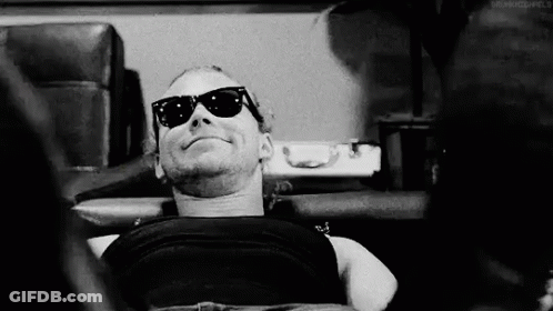Black And White Man In Sunglasses Laying Down GIF