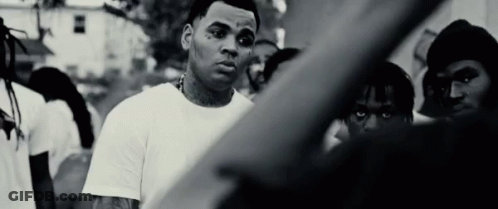 Black And White Man In White Shirt In Front Of Crowd GIF