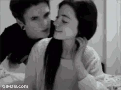 Black And White Man Kissing Woman On Forehead GIF