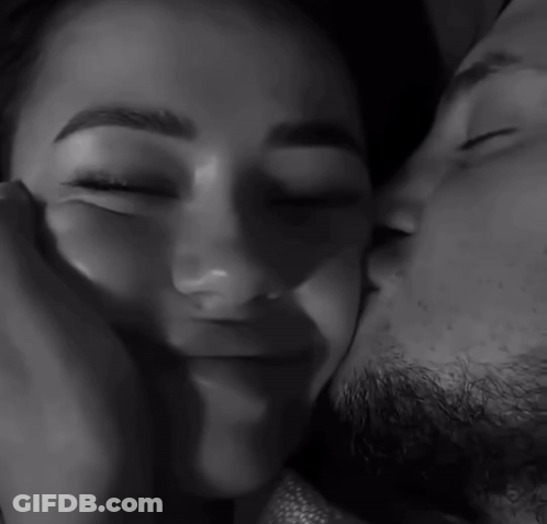 Black And White Man Kissing Woman's Forehead GIF