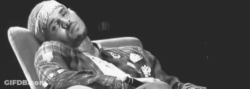 Black And White Man Lying In Chair GIF