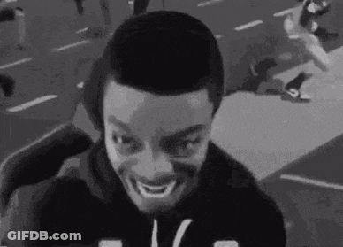 Black And White Man Making Funny Face On Street GIF
