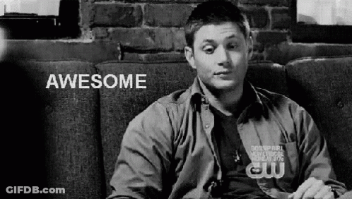 Black And White Man On Couch Saying Awesome GIF