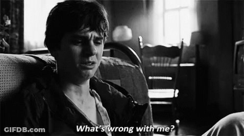 Black And White Man On Couch Saying What's Wrong With Me GIF