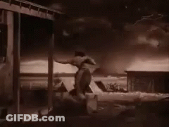 Black And White Man On Porch GIF