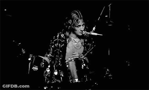 Black And White Man Playing Drums On Stage GIF