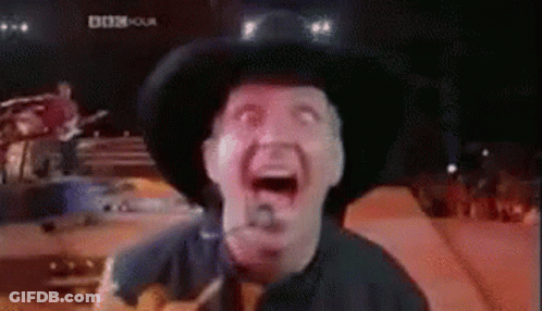 Black And White Man Playing Guitar On Stage GIF