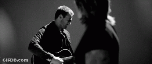 Black And White Man Playing Guitar Woman Watching GIF