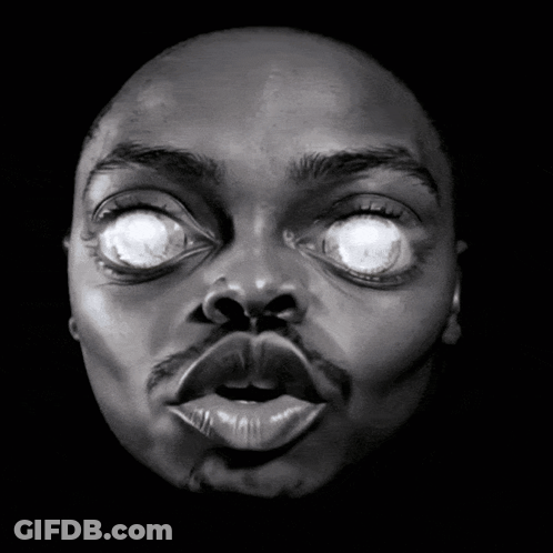 Black And White Man's Face With Glowing Eyes GIF