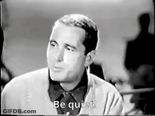 Black And White Man Saying Be Quiet GIF