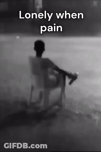 Black And White Man Sitting In Chair Lonely When Pain GIF