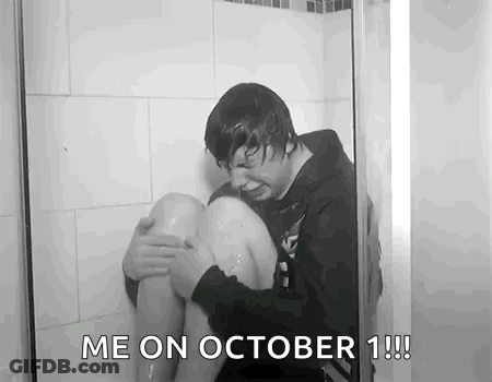 Black And White Man Sitting In Shower With Knee In Water GIF