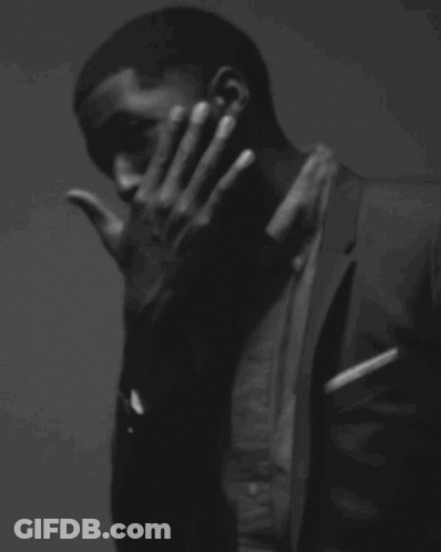 Black And White Man Sitting On Stool With Target GIF