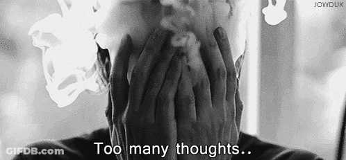 Black And White Man Smoking Cigarette Covering Face GIF
