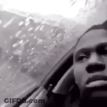 Black And White Man Smoking While Driving GIF