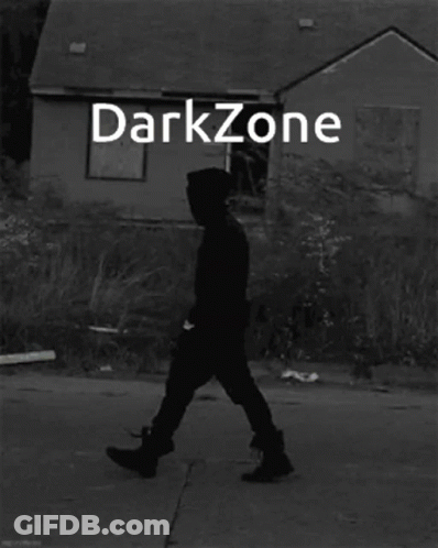 Black And White Man Standing In Front Of Darkzone Building GIF