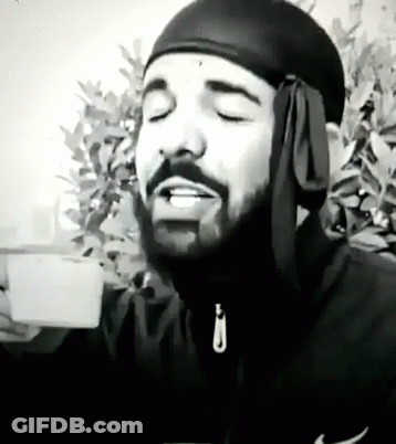 Black And White Man With Beard And Headband Holding Coffee GIF