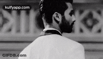 Black And White Man With Beard Wearing Earbuds GIF