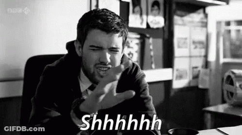 Black And White Man With Funny Face Saying Shhhh GIF