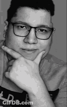 Black And White Man With Glasses Hand To Chin GIF