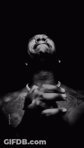 Black And White Man With Hands Folded In Front Of Face With Timestamp GIF