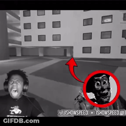 Black And White Man With Headphones And Red Arrow Pointing To IShowSpeed GIF