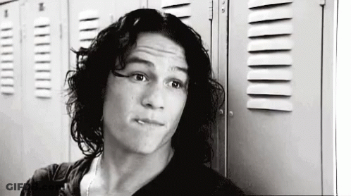 Black And White Man With Long Hair Next To Lockers GIF