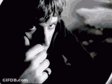 Black And White Man With Ring Looking At Camera GIF