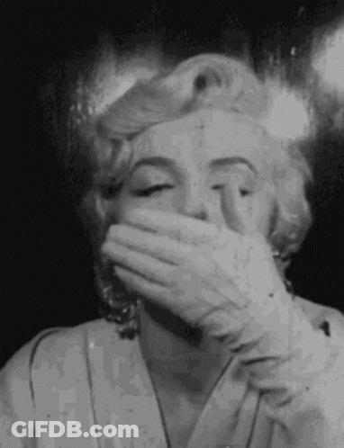 Black And White Marilyn Monroe Covering Mouth With Hand GIF