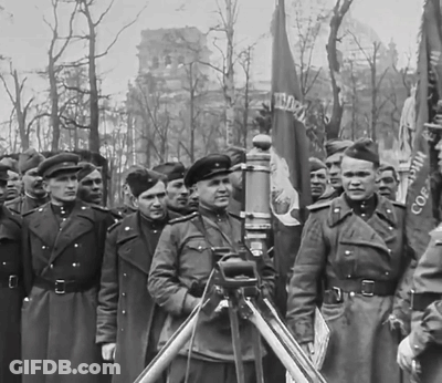 Black And White Men Holding CCCP Flags GIF